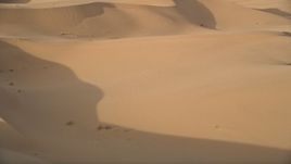 5K aerial  video fly low over sand dunes, Kelso Dunes, Mojave Desert, California Aerial Stock Footage | AX0012_025