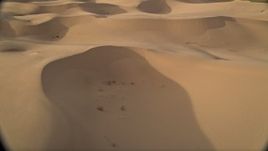 5K aerial stock footage fly low over sand dunes, Kelso Dunes, Mojave Desert, California Aerial Stock Footage | AX0012_026
