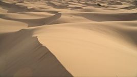 5K aerial stock footage fly low over sand dunes, Kelso Dunes, Mojave Desert, California Aerial Stock Footage | AX0012_027E
