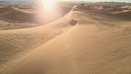 5K aerial stock footage fly low over sand dunes, Kelso Dunes, Mojave Desert, California Aerial Stock Footage | AX0012_029E