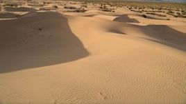 5K aerial stock footage pan across sand dunes, Kelso Dunes, Mojave Desert, California Aerial Stock Footage | AX0012_036