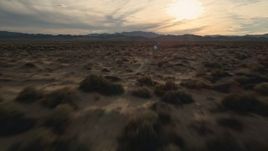 5K aerial stock footage fly low over desert plain, Mojave Desert, California Aerial Stock Footage | AX0012_041E