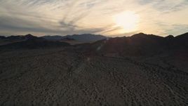 5K aerial stock footage approach desert mountains, Mojave Desert, California, sunset Aerial Stock Footage | AX0012_043