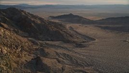 5K aerial stock footage of mountain slopes and desert, Mojave Desert, California, sunset Aerial Stock Footage | AX0012_047