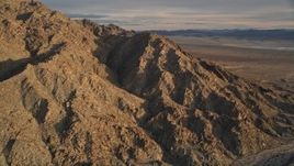 5K aerial stock footage of orbiting a desert mountain, Mojave Desert, California, sunset Aerial Stock Footage | AX0012_048