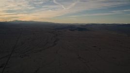 5K aerial stock footage of a flat desert plain at sunset in the Mojave Desert, California Aerial Stock Footage | AX0012_055