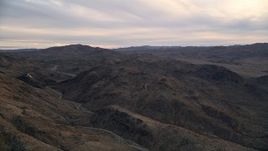 5K aerial stock footage fly by desert mountains, Mojave Desert, California, sunset Aerial Stock Footage | AX0012_058
