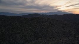 5K aerial stock footage fly over desert mountains, Mojave Desert, California, sunset Aerial Stock Footage | AX0012_060