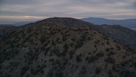 5K aerial stock footage orbiting desert summit peaks, Mojave Desert, California Aerial Stock Footage | AX0012_061
