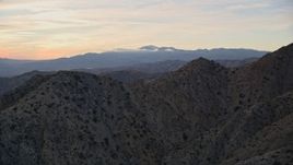 5K aerial stock footage fly over desert mountains, Mojave Desert, California, sunset Aerial Stock Footage | AX0012_062
