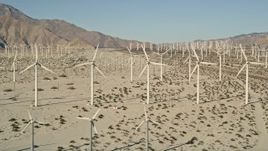 5K aerial stock footage of wind farm in the desert, San Gorgonio Pass Wind Farm, California Aerial Stock Footage | AX0013_006E