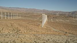 5K aerial stock footage fly by windmills in the desert, San Gorgonio Pass Wind Farm, California Aerial Stock Footage | AX0013_013