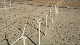5K aerial stock footage fly over a row of windmills, San Gorgonio Pass Wind Farm, California Aerial Stock Footage | AX0013_023