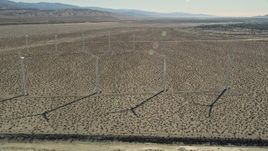 5K aerial stock footage fly by windmills in the desert, San Gorgonio Pass Wind Farm, California Aerial Stock Footage | AX0013_031