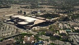 5K aerial stock footage of fly over residential neighborhoods toward a convention center, West Palm Springs, California Aerial Stock Footage | AX0013_037E