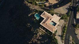 5K aerial stock footage of a bird's eye view of a mansion in the hills, West Palm Springs, California Aerial Stock Footage | AX0013_047