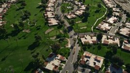 5K aerial stock footage of condominiums among a golf course, Rancho Mirage, California Aerial Stock Footage | AX0013_065E