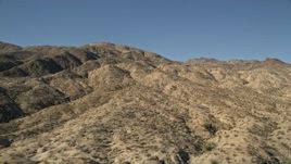 5K aerial stock footage of flying up hills toward San Jacinto Mountains, California Aerial Stock Footage | AX0014_001