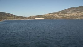 5K aerial stock footage fly low over Lake Hemet and approach Hemet Dam, California Aerial Stock Footage | AX0014_027
