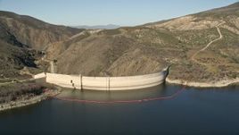 5K aerial stock footage fly low over Lake Hemet and approach Hemet Dam, California Aerial Stock Footage | AX0014_028