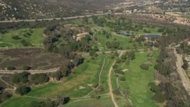 5K aerial stock footage of flying over a golf course, Temecula, California Aerial Stock Footage | AX0014_051