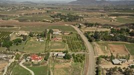 5K aerial stock footage fly over rural homes and vineyards, Temecula, California Aerial Stock Footage | AX0014_056