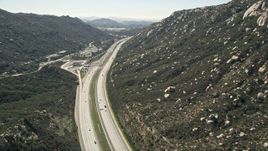5K aerial stock footage of interstate at the foot of mountains, Temecula, California Aerial Stock Footage | AX0015_003