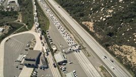 5K aerial stock footage approach and orbit highway inspection facility beside the freeway, Temecula, California Aerial Stock Footage | AX0015_004E