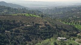 5K aerial stock footage approach farmland and homes on hills, Fallbrook, California Aerial Stock Footage | AX0015_019