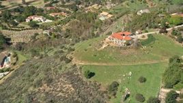 5K aerial stock footage of orbiting a house on a hilltop, Fallbrook, California Aerial Stock Footage | AX0015_023