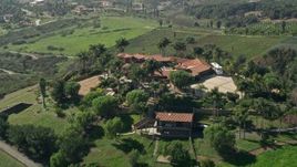 5K aerial stock footage approach a large house atop a hill, Fallbrook, California Aerial Stock Footage | AX0015_028E