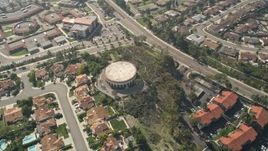 5K aerial stock footage of a circular building in a residential community, Oceanside, California Aerial Stock Footage | AX0015_047