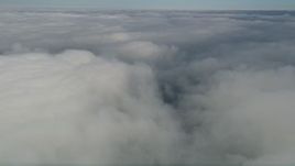 5K aerial stock footage pan across dense clouds over California Aerial Stock Footage | AX0016_018