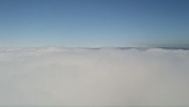 5K aerial stock footage pan across clouds and tilt up to the blue sky, California Aerial Stock Footage | AX0016_043