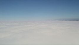 5K aerial stock footage pan across clouds with blue skies above, California Aerial Stock Footage | AX0016_052