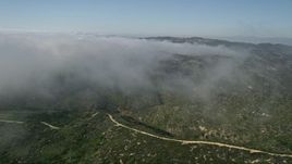 5K aerial stock footage fly over green hills and rolling fog, Laguna Beach, California Aerial Stock Footage | AX0016_064