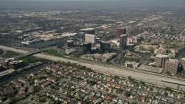 5K aerial stock footage fly over homes to approach office buildings on the other side of Interstate 405, Costa Mesa, California Aerial Stock Footage | AX0016_085E