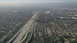 5K aerial stock footage tilt from a bird's eye view of Interstate 405 and reveal the Highway 73 interchange, Costa Mesa, California Aerial Stock Footage | AX0016_088