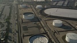 5K aerial stock footage tilt down on an oil refinery, Carson, California Aerial Stock Footage | AX0017_006