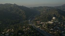 5K aerial stock footage of Highway 101 through the Hollywood Hills, Hollywood, California Aerial Stock Footage | AX0017_085