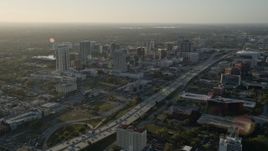 5K aerial stock footage of Downtown Orlando and Interstate 4 at sunrise in Florida Aerial Stock Footage | AX0018_011E