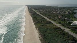 5K aerial stock footage fly over sandy shore of Melbourne Beach in Florida Aerial Stock Footage | AX0018_079E