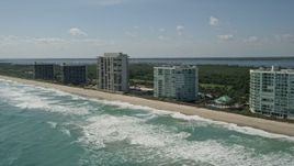 5K aerial stock footage of passing apartment buildings in Jensen Beach, Florida  Aerial Stock Footage | AX0019_006