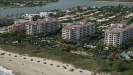 5K aerial stock footage of oceanfront hotel and beach at Palm Beach Shores, Florida Aerial Stock Footage | AX0019_051