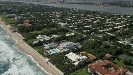 5K aerial stock footage fly over and tilt to oceanfront mansions in Palm Beach, Florida Aerial Stock Footage | AX0019_055