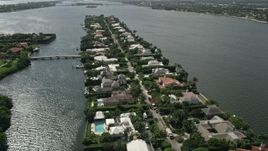5K aerial stock footage approach and fly over lakefront mansions in Palm Beach Aerial Stock Footage | AX0019_063E