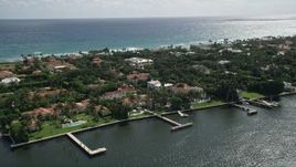 5K aerial stock footage flyby lakefront mansions with docks in Palm Beach, Florida Aerial Stock Footage | AX0019_067