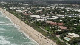 5K aerial stock footage of Ocean Ridge coastal community, tilt to apartment buildings in Florida Aerial Stock Footage | AX0019_086