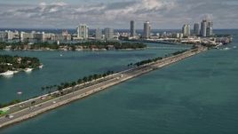 5K aerial stock footage tilt from light traffic on MacArthur Causeway to reveal South Beach, Florida Aerial Stock Footage | AX0020_037