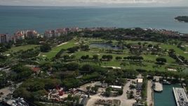5K aerial stock footage of an island golf course on Fisher Island, Florida Aerial Stock Footage | AX0020_041